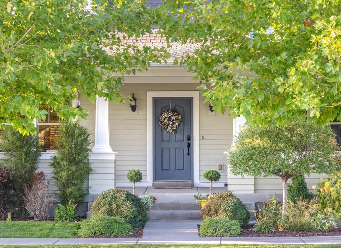 ErieSecure Home Bundles - Front of a House in Spring with Black Light Fixtures